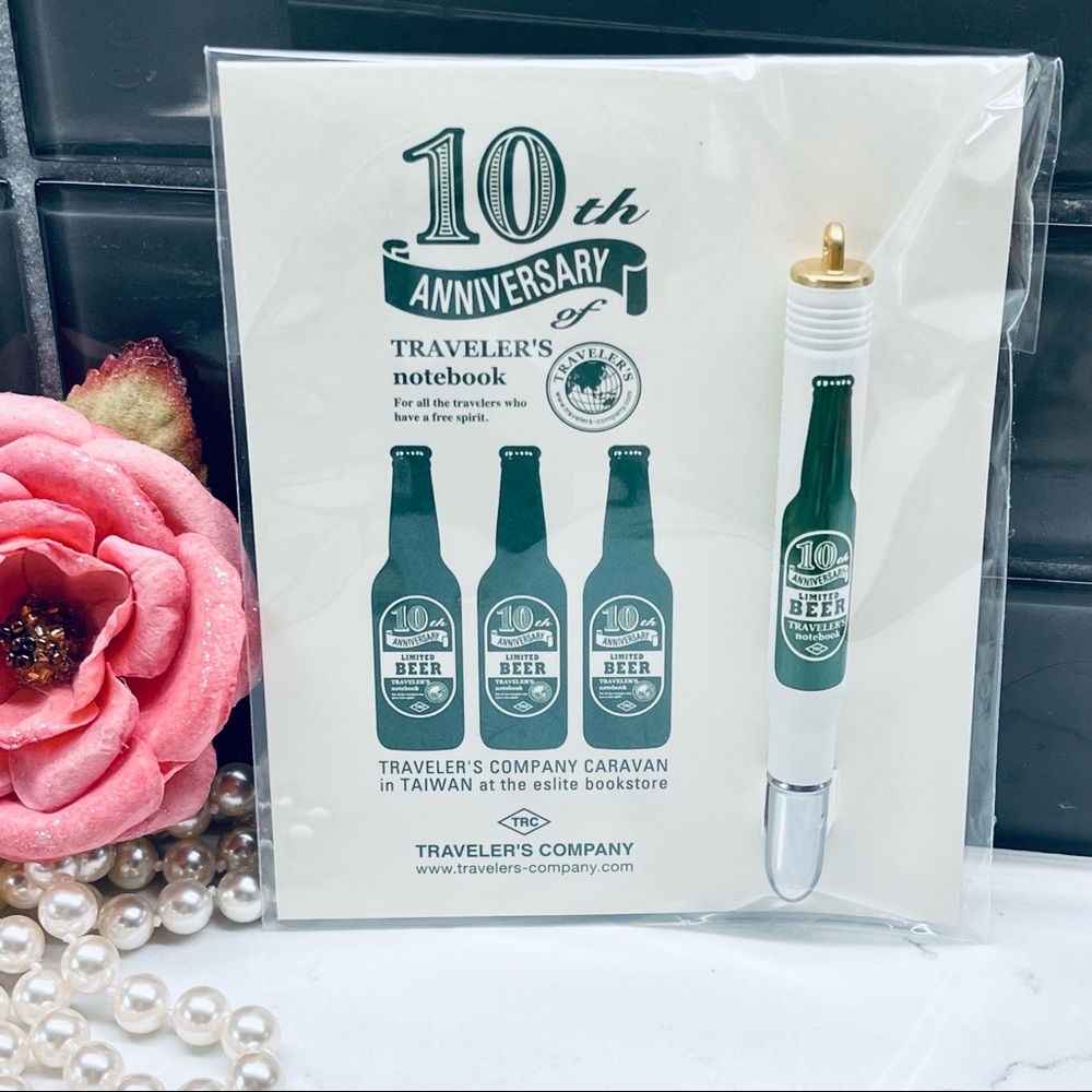 Midori Traveler's Notebook Limited Edition caravan beer pen. Black ball pen